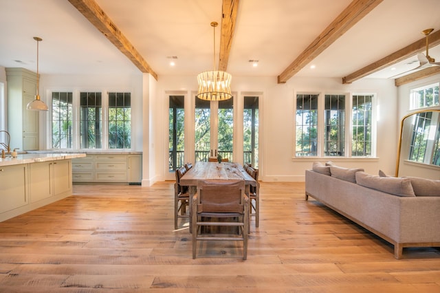 515 Claret Way, Kiawah Island, SC 29455 - dining area with light wood finished floors, a chandelier, beam ceiling, and baseboards