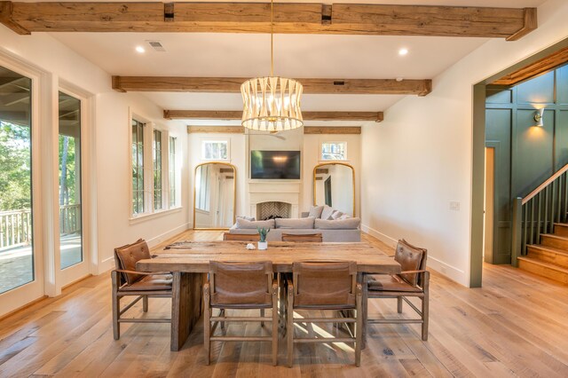 515 Claret Way, Kiawah Island, SC 29455 - dining area with baseboards, light wood finished floors, stairway, a fireplace, and beamed ceiling