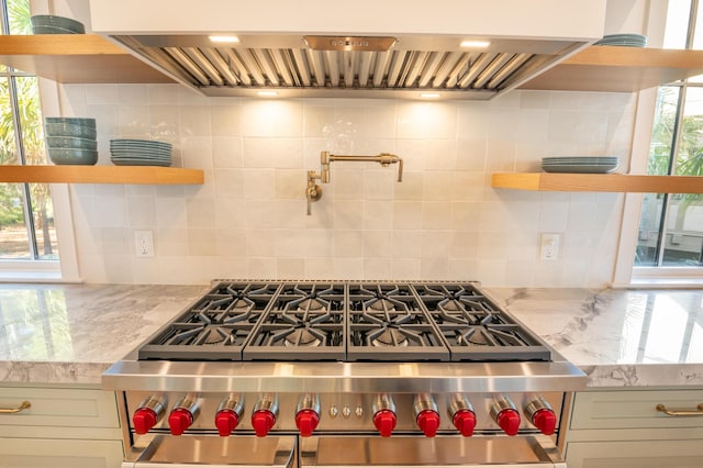 515 Claret Way, Kiawah Island, SC 29455 - kitchen with open shelves, range with two ovens, custom exhaust hood, and decorative backsplash