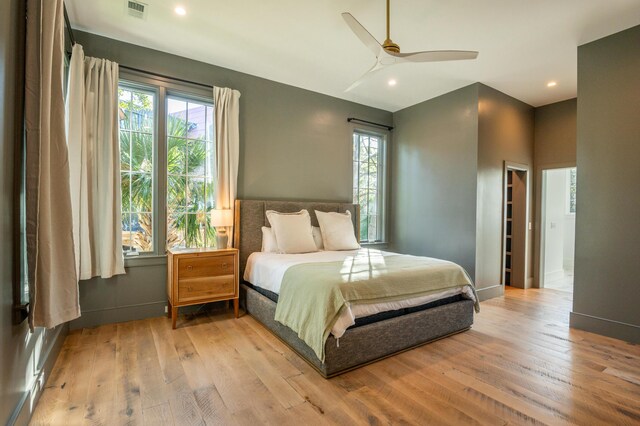 515 Claret Way, Kiawah Island, SC 29455 - bedroom featuring multiple windows, wood finished floors, recessed lighting, baseboards, and ceiling fan