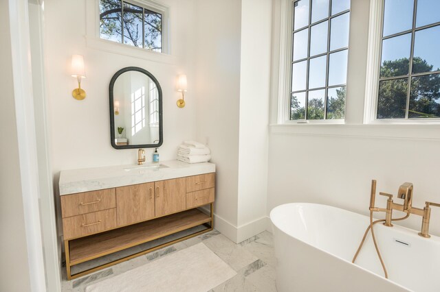 515 Claret Way, Kiawah Island, SC 29455 - full bath featuring marble finish floors, plenty of natural light, a freestanding tub, and vanity