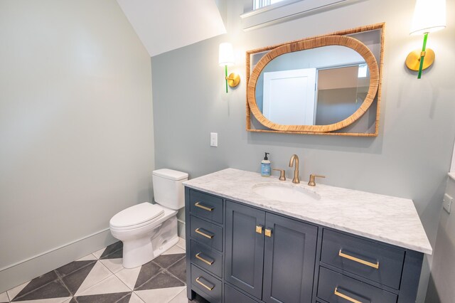 515 Claret Way, Kiawah Island, SC 29455 - bathroom with toilet, vanity, vaulted ceiling, baseboards, and tile patterned floors