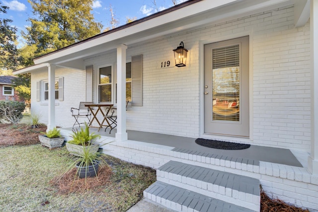 doorway to property featuring a porch