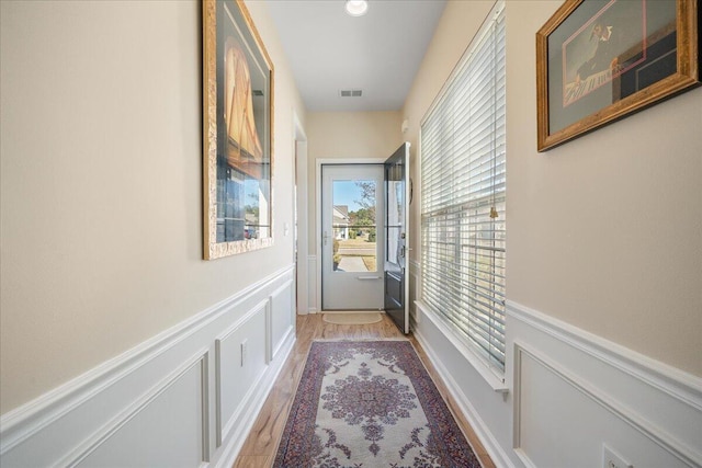 entryway with light hardwood / wood-style floors