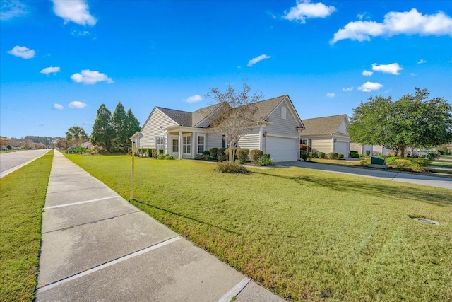 view of front of home with a garage and a front lawn