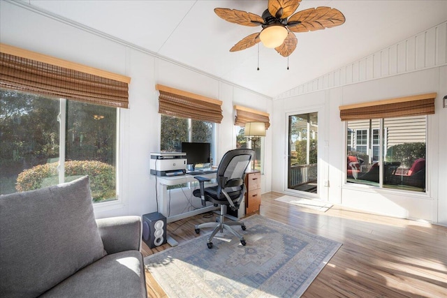 home office featuring vaulted ceiling, ceiling fan, and hardwood / wood-style floors