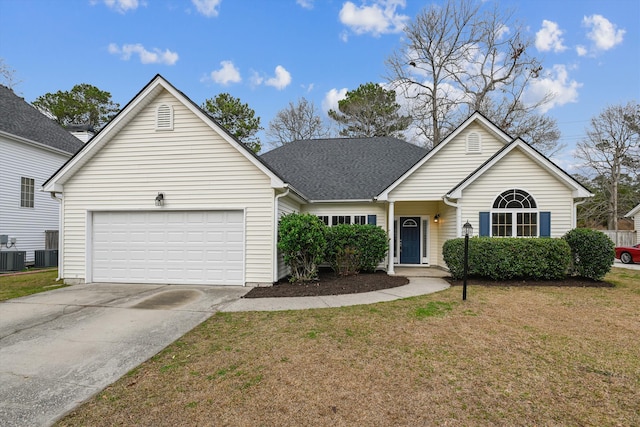 view of front of home with a garage, central air condition unit, and a front lawn