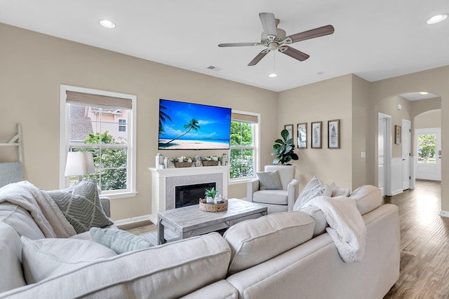 2961 Waterleaf Rd, Johns Island, SC 29455 - living room with arched walkways, wood finished floors, ceiling fan, baseboards, and recessed lighting