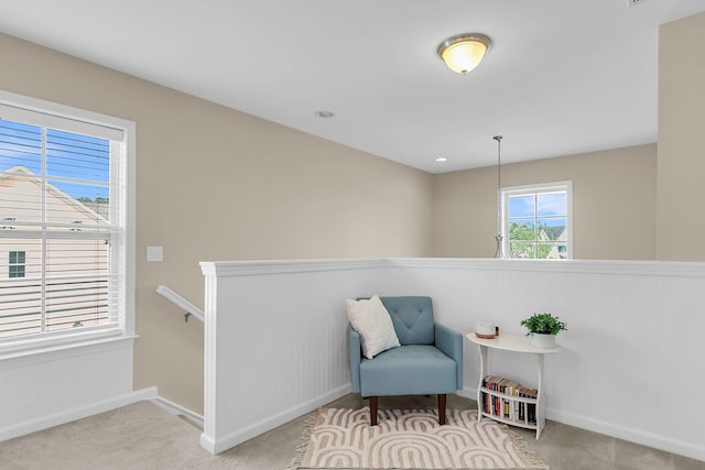 2961 Waterleaf Rd, Johns Island, SC 29455 - living area with carpet, a wainscoted wall, an upstairs landing, and baseboards
