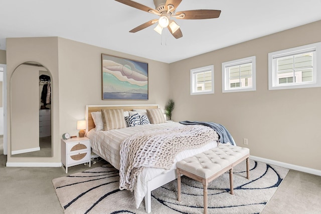 2961 Waterleaf Rd, Johns Island, SC 29455 - bedroom with carpet flooring, baseboards, arched walkways, and a ceiling fan
