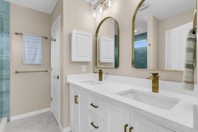 2961 Waterleaf Rd, Johns Island, SC 29455 - full bathroom with marble finish floors, baseboards, double vanity, and a tile shower