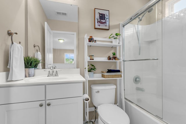 2961 Waterleaf Rd, Johns Island, SC 29455 - bathroom featuring vanity, toilet, and bath / shower combo with glass door