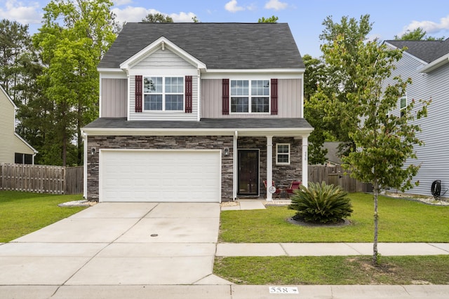 558 Wynfield Forest Dr, Summerville, SC 29485 - view of front facade featuring a front yard, stone siding, and board and batten siding