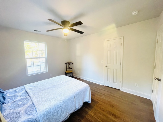 bedroom featuring dark wood-type flooring and ceiling fan