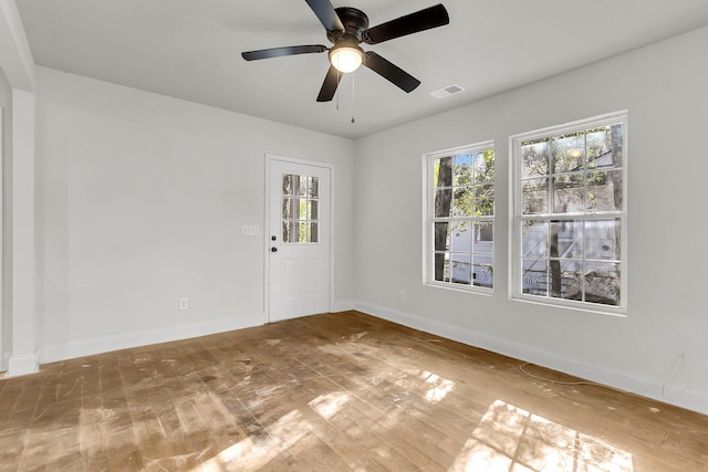 empty room featuring ceiling fan and hardwood / wood-style flooring