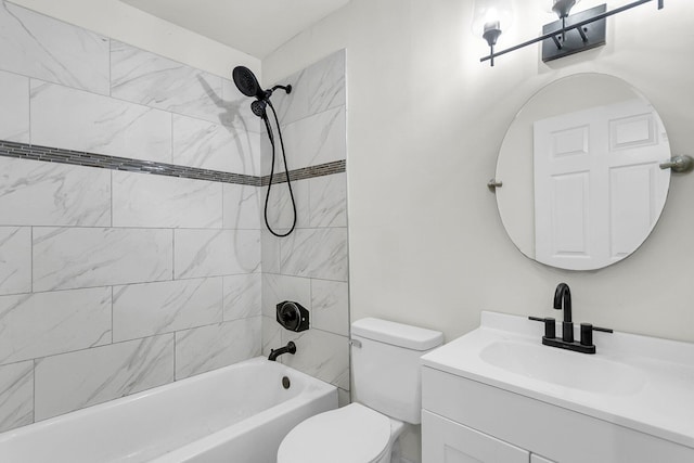 full bathroom with toilet, tiled shower / bath, and vanity