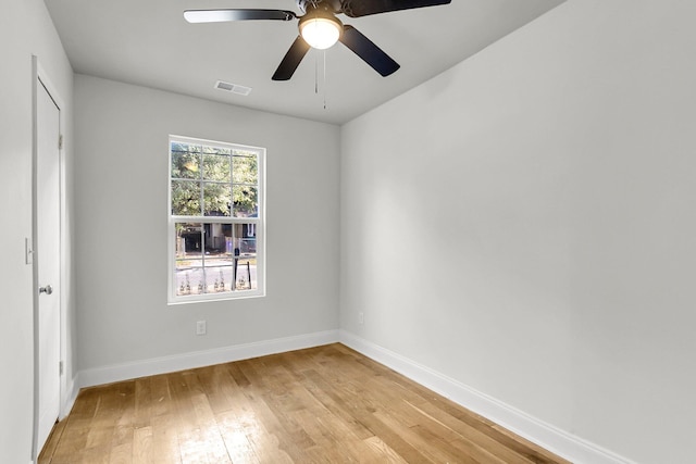 empty room featuring light wood-type flooring and ceiling fan