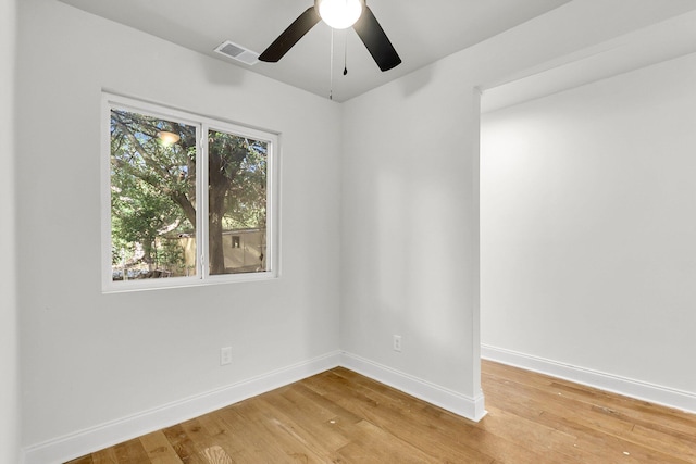 spare room featuring ceiling fan and wood-type flooring