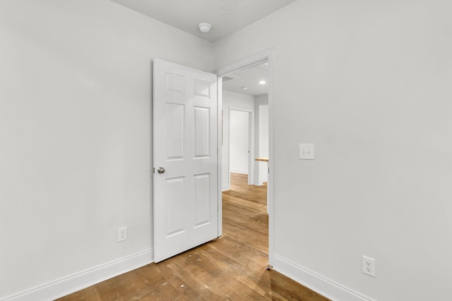 unfurnished room featuring wood-type flooring