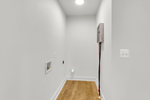 clothes washing area featuring light wood-type flooring, electric dryer hookup, and hookup for a washing machine