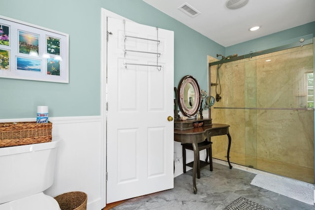 8346 Chisolm Plantation Rd, Edisto Island, SC 29438 - full bath with tiled shower, toilet, and wainscoting