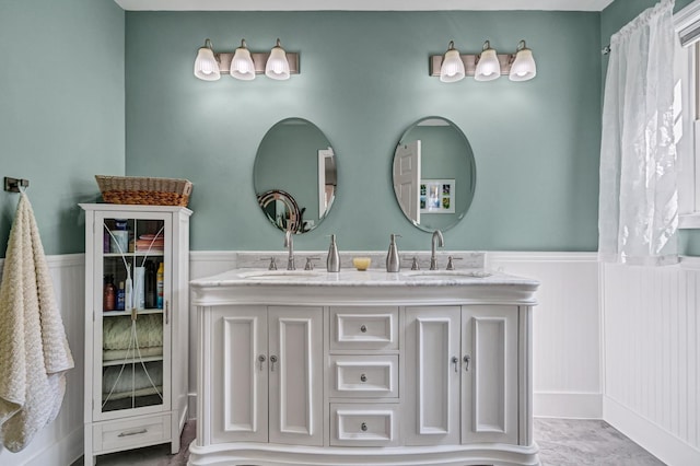 8346 Chisolm Plantation Rd, Edisto Island, SC 29438 - bathroom with a wainscoted wall, double vanity, and a decorative wall