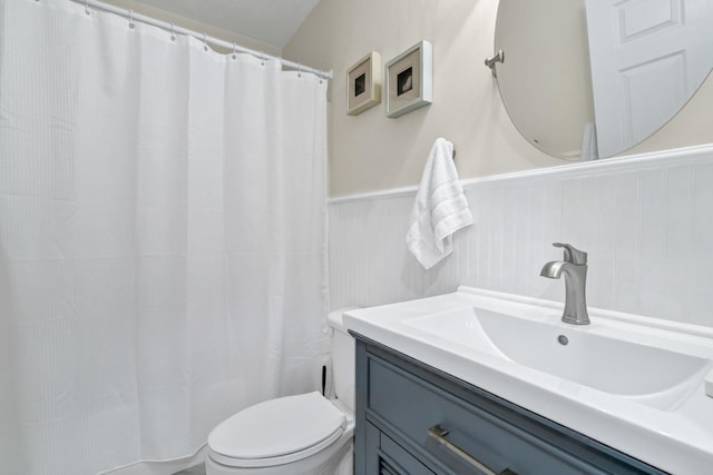 8346 Chisolm Plantation Rd, Edisto Island, SC 29438 - bathroom with a wainscoted wall, toilet, vanity, and a shower with shower curtain