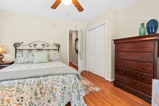8346 Chisolm Plantation Rd, Edisto Island, SC 29438 - bedroom with light wood-style floors, a closet, baseboards, and ceiling fan