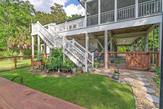 8346 Chisolm Plantation Rd, Edisto Island, SC 29438 - view of patio / terrace featuring stairs, a deck, a gate, and a sunroom