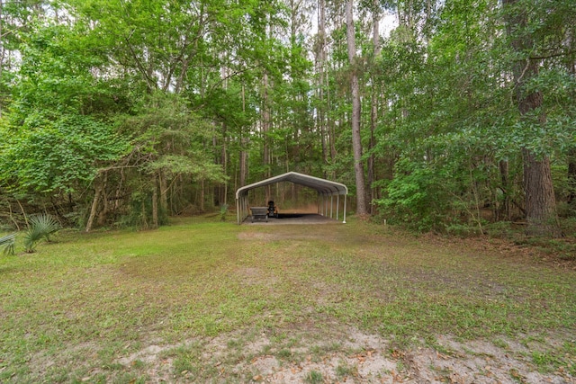 8346 Chisolm Plantation Rd, Edisto Island, SC 29438 - view of grassy yard with a carport and a forest view