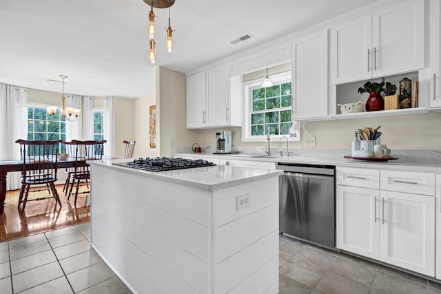 8346 Chisolm Plantation Rd, Edisto Island, SC 29438 - kitchen with dishwasher, gas cooktop, healthy amount of natural light, and a chandelier