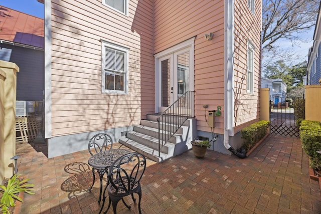 property entrance with a patio