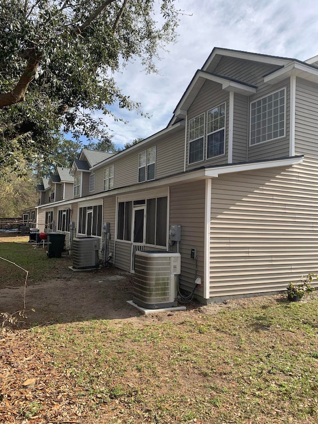 back of property with central air condition unit