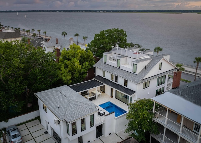 aerial view at dusk with a water view