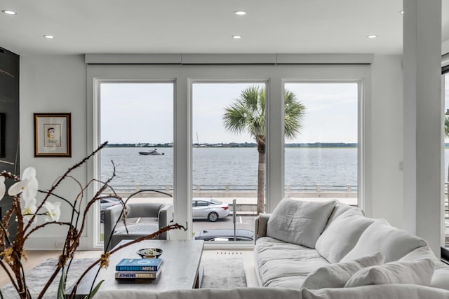 living room featuring a water view