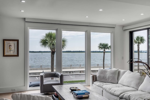 living room featuring a water view