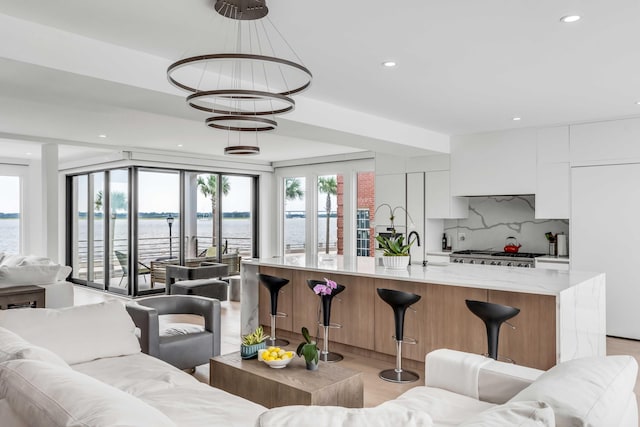 living room featuring a water view