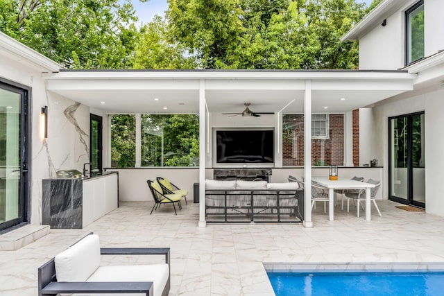 view of patio / terrace featuring ceiling fan and an outdoor living space