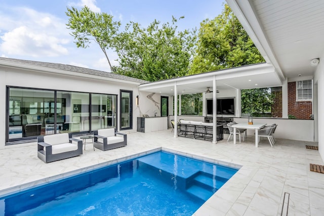 view of pool with a patio area, outdoor lounge area, and ceiling fan