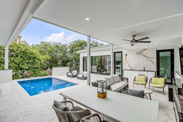 view of pool featuring an outdoor living space, a patio, and ceiling fan