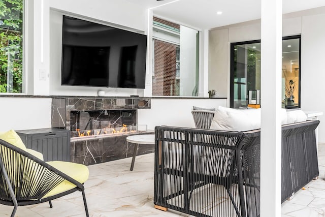 view of patio with a stone fireplace