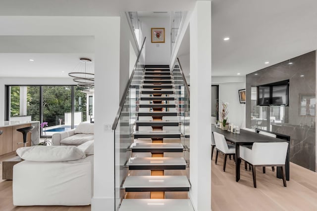 staircase with wood-type flooring