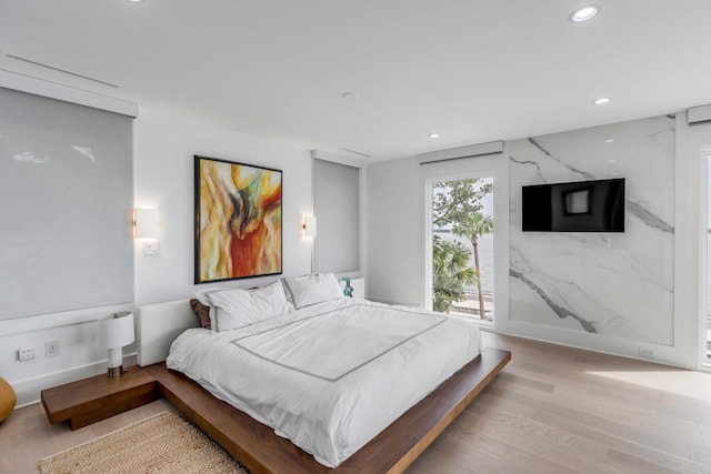 bedroom with light wood-type flooring