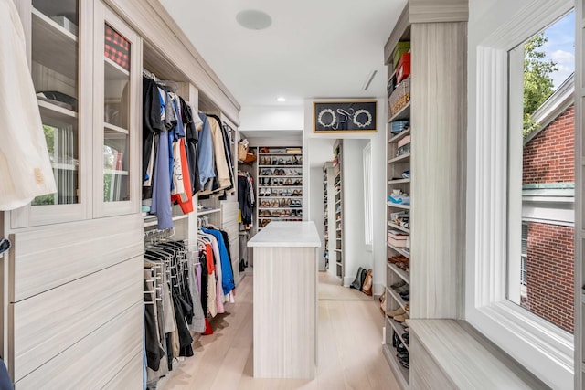 spacious closet with light hardwood / wood-style floors