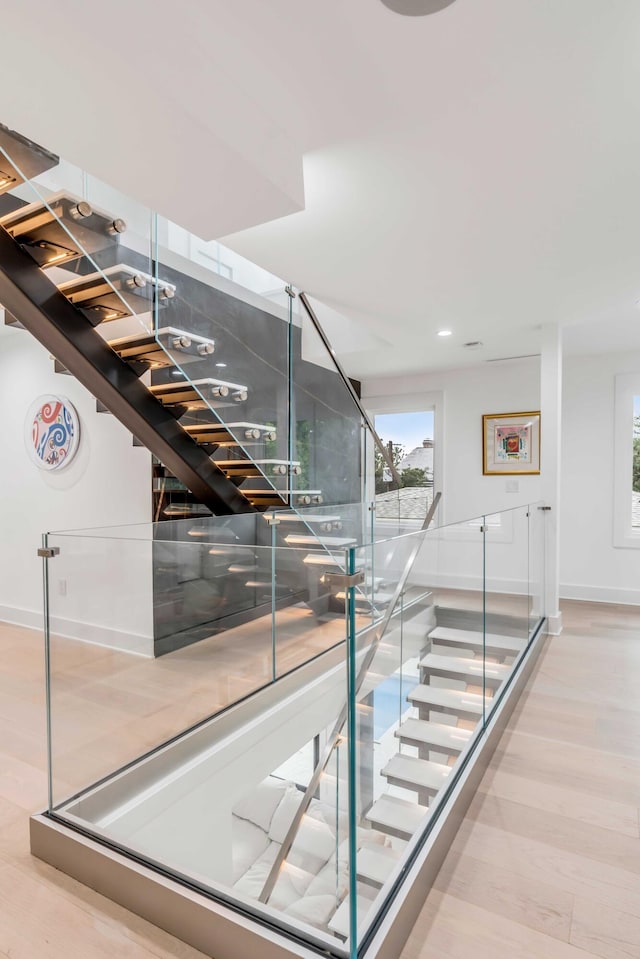 stairway featuring hardwood / wood-style flooring