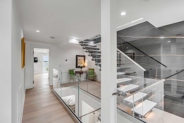 staircase with wood-type flooring