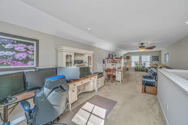 office area featuring light carpet, ceiling fan, and lofted ceiling