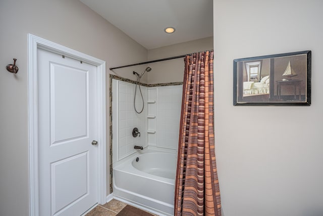 bathroom featuring tile patterned flooring and shower / bath combination with curtain