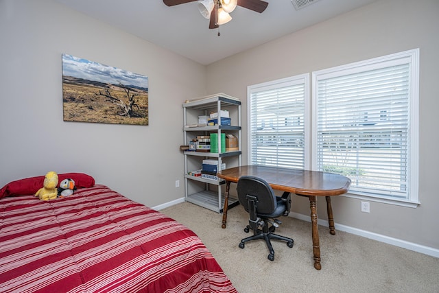 bedroom featuring carpet flooring, ceiling fan, and multiple windows