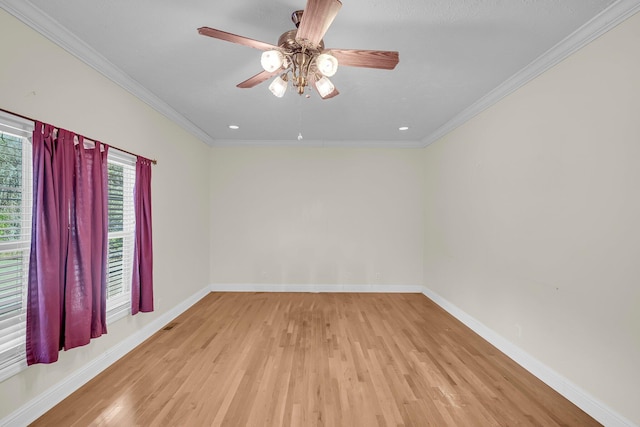 unfurnished room featuring crown molding, ceiling fan, and light wood-type flooring